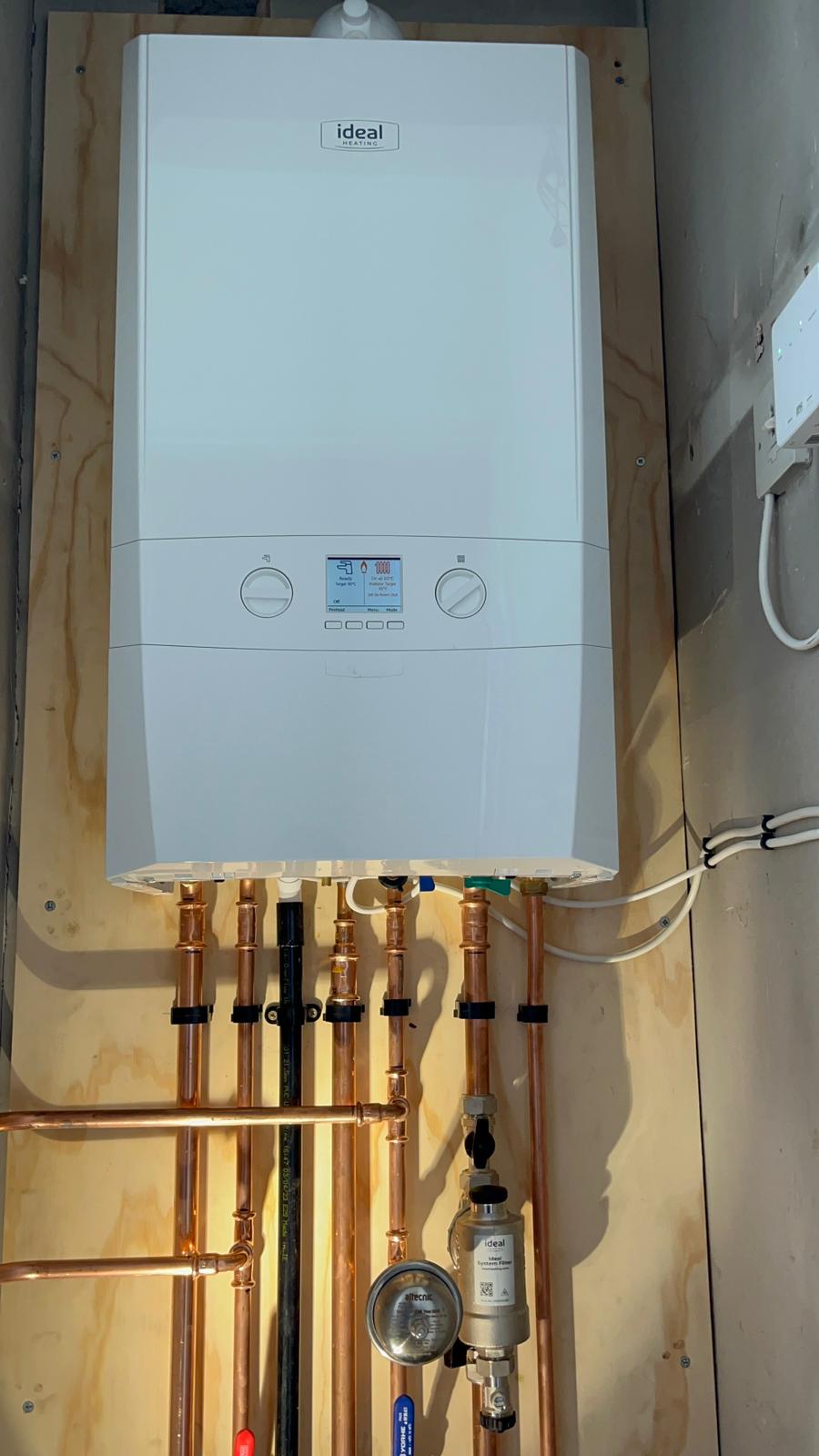 Ideal Heating boiler installation with system filter and pipework